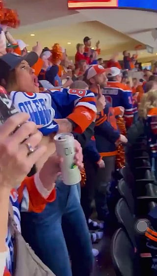 Wild Fan Moment: Woman Gets Excited at Hockey Game'
