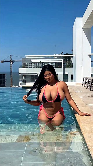 Big Tits Bikini Babe in a Micro Bikini'