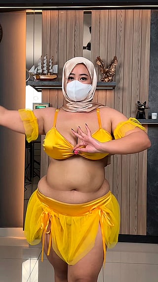 Chubby Asian Woman Wearing Mask and Yellow Outfit'