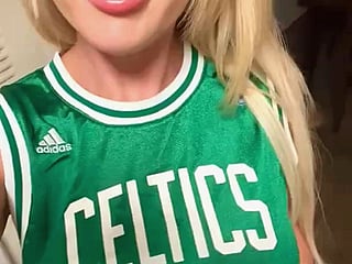 Solo Teen Girl Shows Off Her Long Hair in a Green Celtics Jersey'