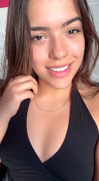 Smiling Teen Girl with Piercing and Necklace'