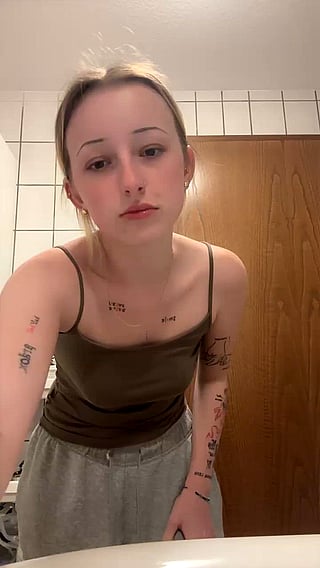 Do I Look Good Sir?: A Young Woman's Selfie with Tattoos and Piercings'
