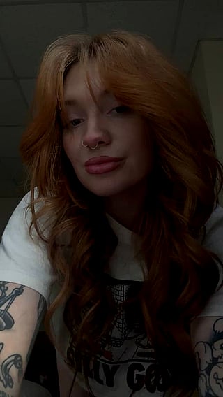 Redhead with Tattoo and Piercing Poses for Silly Goose Shirt'