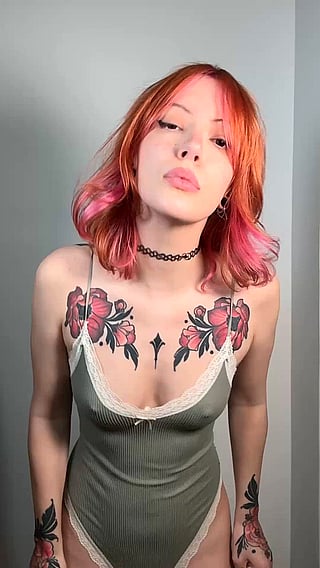 Redhead Babe Shows Off Her Tits in a Homemade Video'