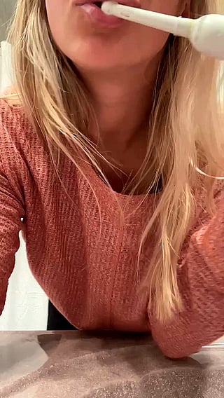 Blonde MILF Shows Off Her Tits While Doing Multiple Tasks'