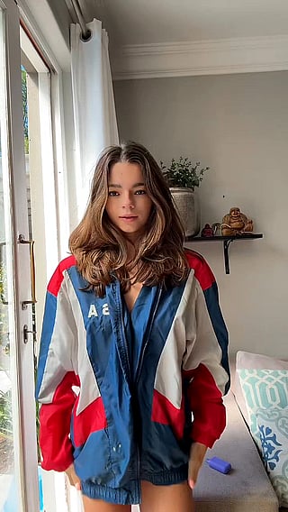 Shy Teen Girl in Blue and White Jacket'
