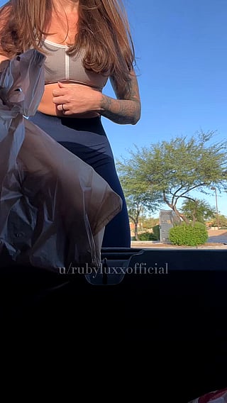 Showing off my big tits in the grocery store parking lot'
