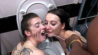 Piss Slut: Two Naked Women Pissing in a Bathroom'