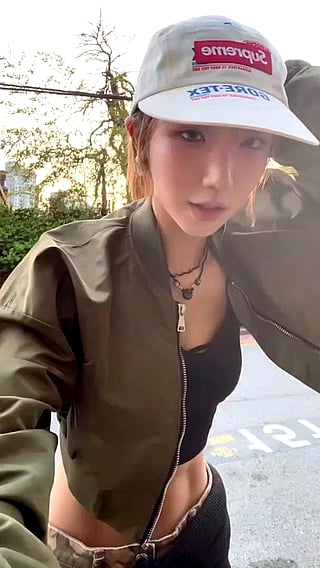 Busty Teen in Green Jacket and Hat'