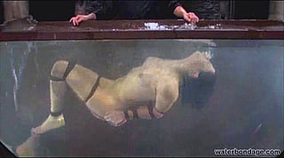 Bobbi Starr Struggles to Stay Upright in a Tank of Water'