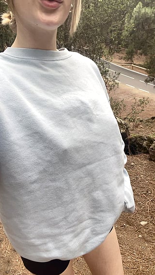 Showing off my sweater and the cars passing by'