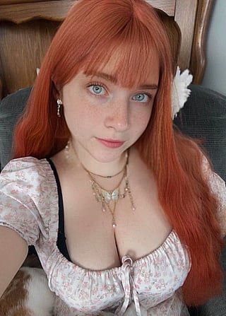 Redheaded MILF with Big Tits and Piercing Blue Eyes'
