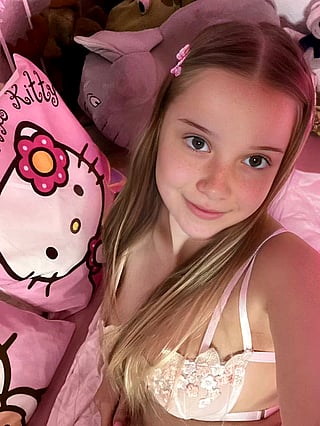 Shy Babe Takes Selfie in Pink Hello Kitty Bedroom'