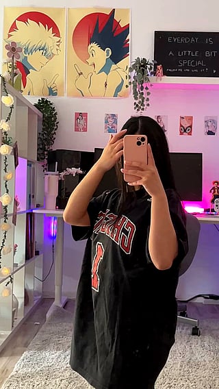 Haitian Teen Takes Selfie in Black Shirt and Blocks View'