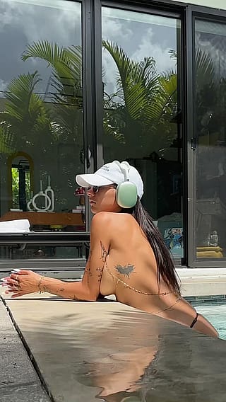 Showing off set of white nails at a pool'